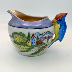 Vintage creamer with bird handle